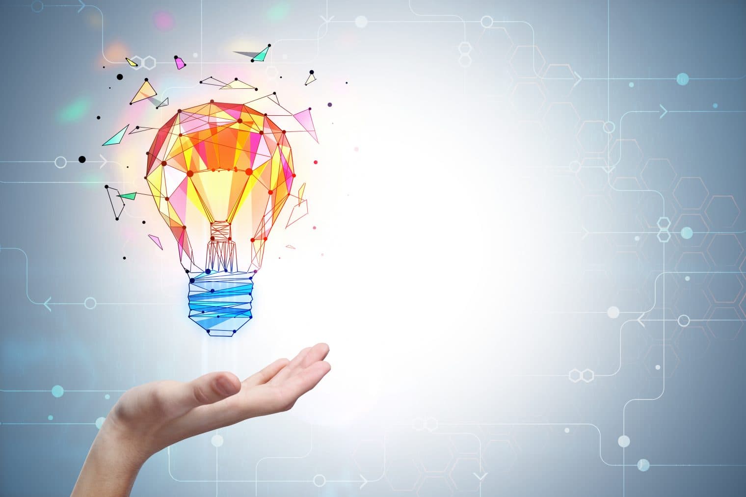 iStock image of an open palm. A colourful lightbulb shines above the hand.