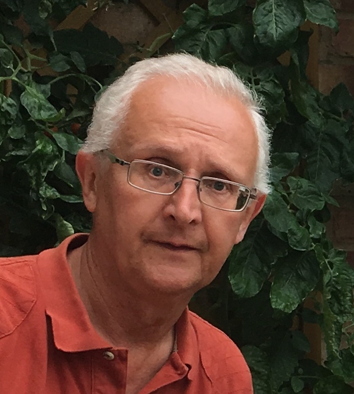 A man (Andy) with glasses and a red shirt