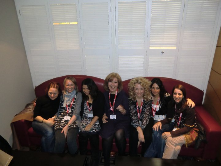 Marisa with a group of women sat happily on a sofa at a 'tweet-up' at Iatefl. 